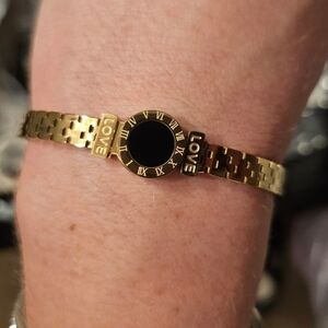 Gold Bracelet with Black Roman Numeral Dial